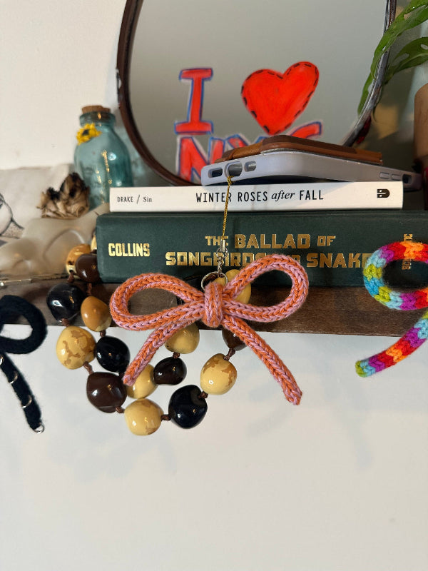 OMBRE KNIT BOW CHARM ACCESSORY ON PHONE AND BOOK COLLABORATION  WITH BYKARYA