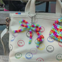 Rainbow Knit Bow Charm by BYKARYA